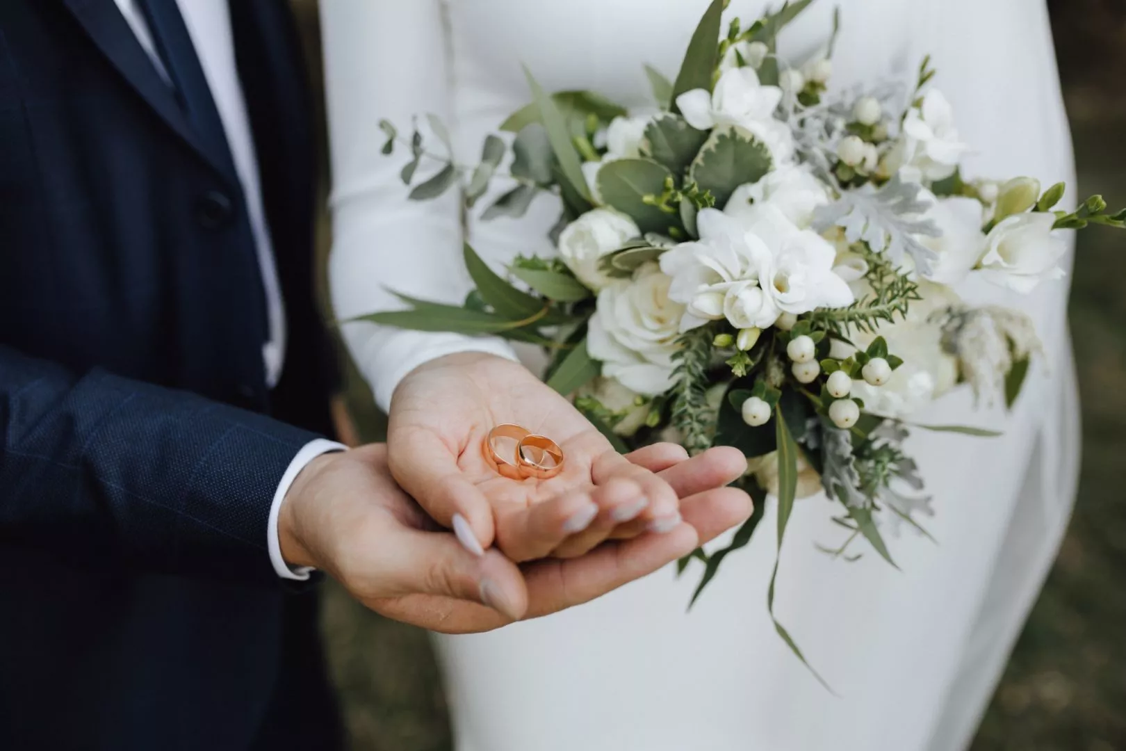 Hands Holding Wedding Rings